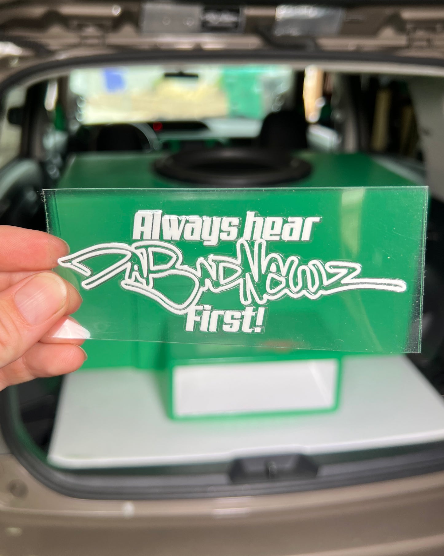 White sticker with 'Always hear DaBadNewz first!" logo and text