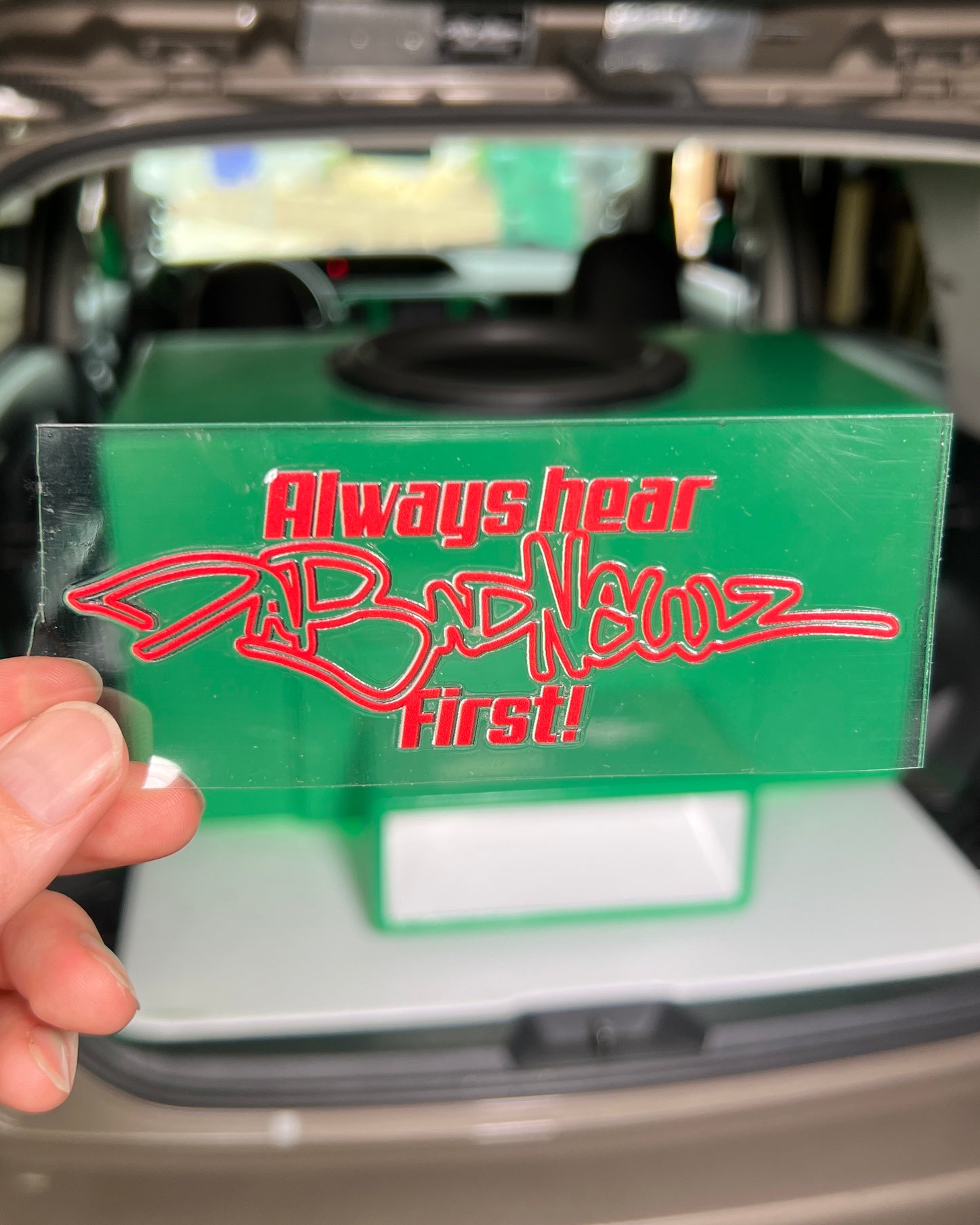 Red sticker with 'Always hear DaBadNewz first!" logo and text