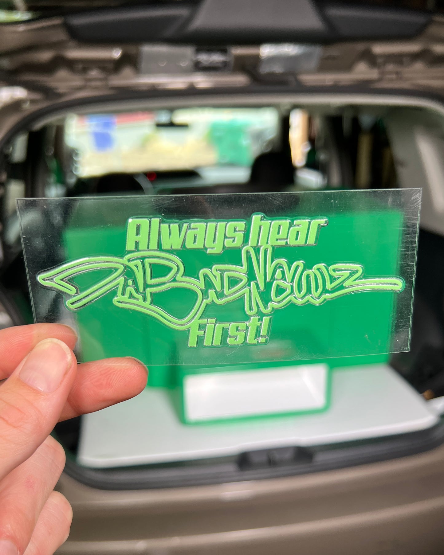 Green sticker with 'Always hear DaBadNewz first!" logo and text