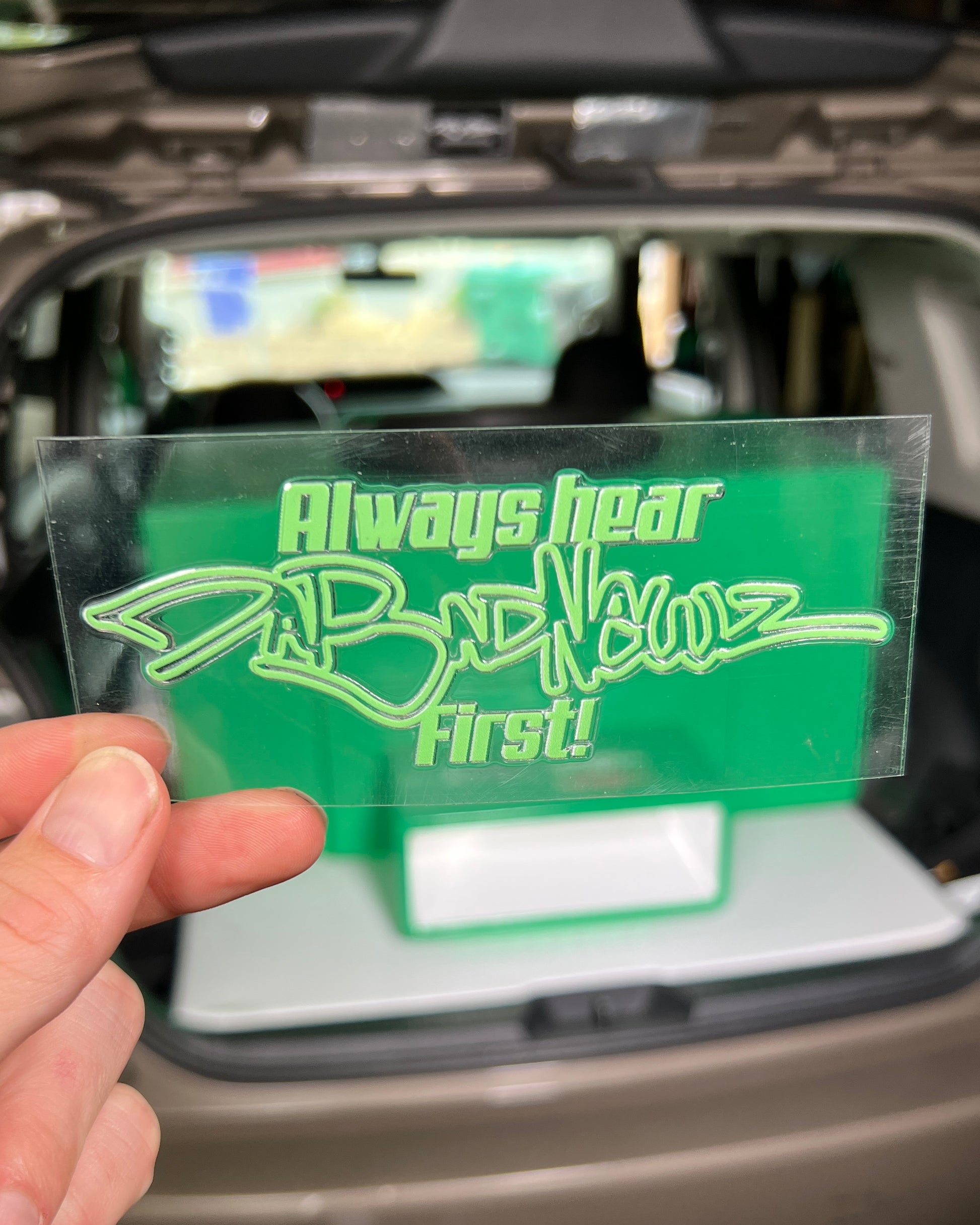 Green sticker with 'Always hear DaBadNewz first!" logo and text